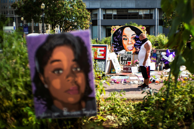 Image: People react after a decision in the criminal case against police officers involved in the death of Breonna Taylor, in Louisville