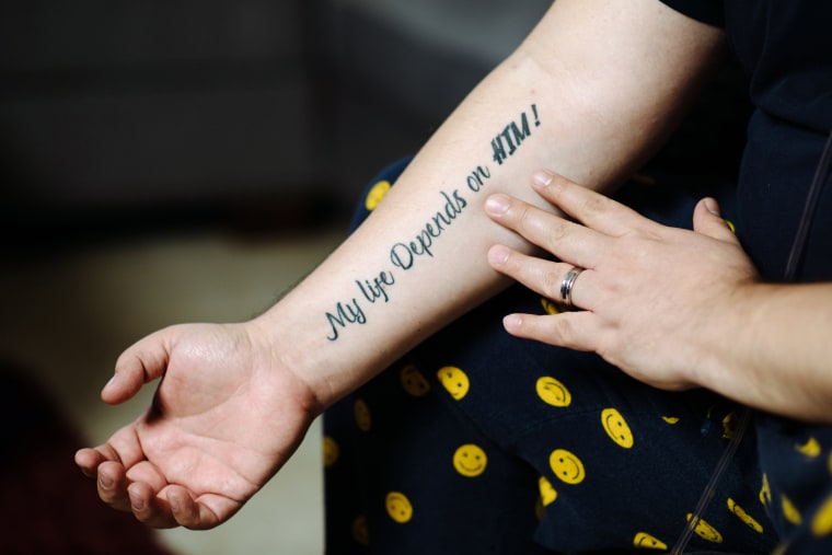 Image: Mauricio Marin shows the message he had tattooed on his arm after being discharged from a Covid-19 ICU.