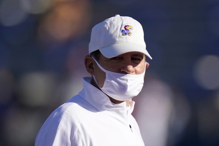Image: Kansas head coach Les Miles watches his team warm up before an NCAA college football game against Iowa State in Lawrence, Kan.,