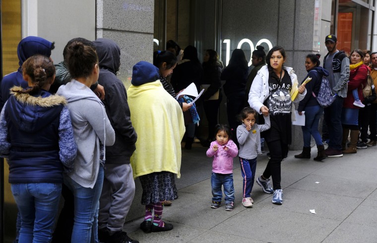 Hundreds of people stand in line outside an immigration office in San Francisco on Jan. 31, 2019.