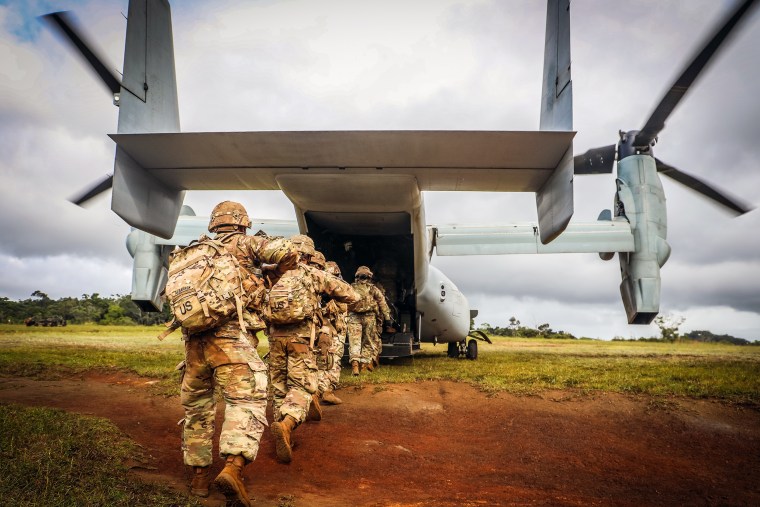 Image: Soldiers board an Osprey for a live fire mission during a training exercise on Dec. 9, 2020 at East Range Schofield Barracks, Hawaii.
