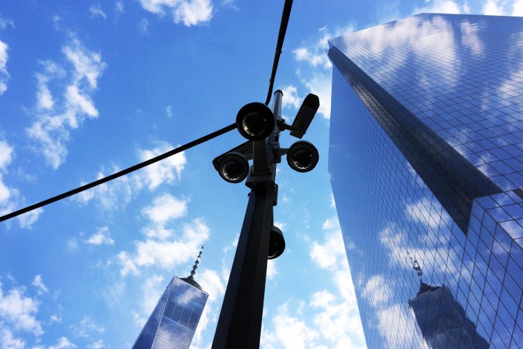 Security cameras provide surveillance of streets near One World Trade Center, left, and 4 World Trade Center on June 13, 2017, in New York.