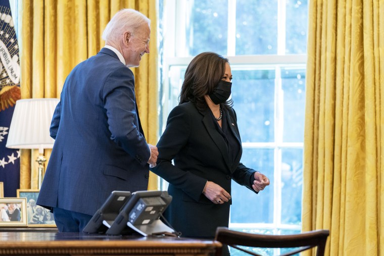 President Joe Biden and Vice President Kamala Harris smile after Biden signed the American Rescue Plan at the White House on March 11, 2021.