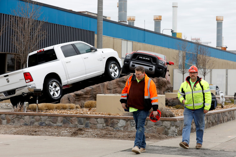 Workers leave FCA Chrysler Warren Truck Assembly after the Detroit three automakers have agreed to UAW demands to shut down all North America plants as a precaution against coronavirus on March 18, 2020 in Detroit.