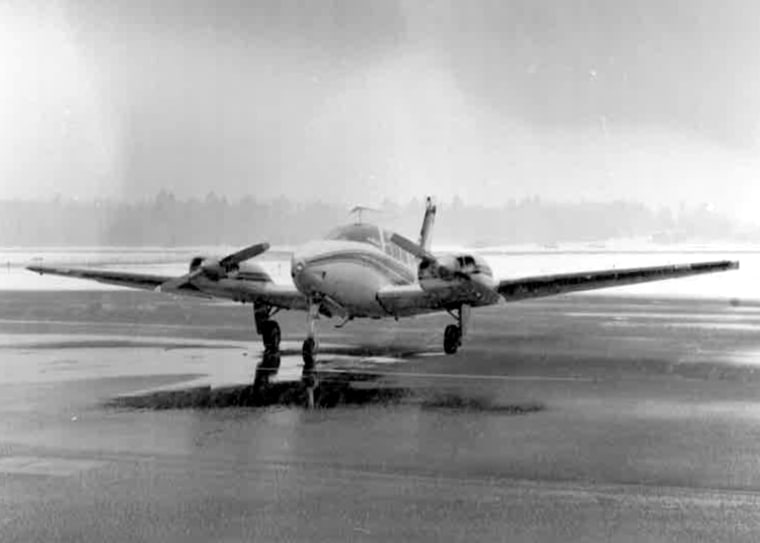 Image: A photograph contained in the case file shows an airplane landing in Escanaba, Mich. Detectives flew from Port Huron, Mich. to Escanaba while investigating the murder of Scott Macklem.