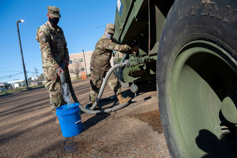 Image: Water shortage due to a recent bout of cold weather stretches into a third week in Jackson