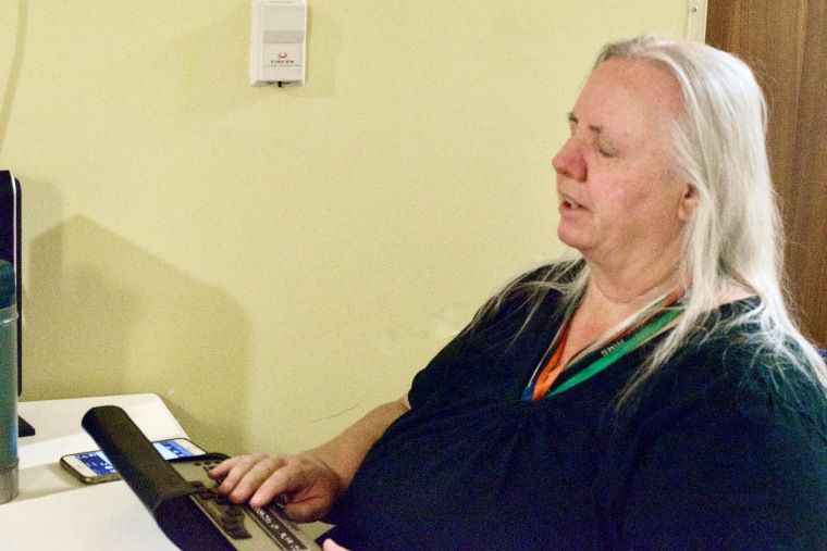 Yolanda Thompson Using a Vario Ultra Braille Note Taking device connected to her computer.