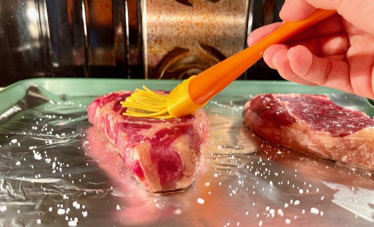 Before you stick your steak under the broiler to get a good crust, brush it with oil so it doesn't burn.