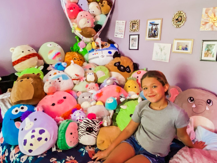 My daughter, Kennedy, with her collection of more than 80 Squishmallows.