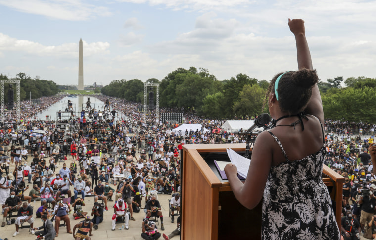 Yolanda Renee King raises her fist as she speaks during the March on Washington in August 2020.
