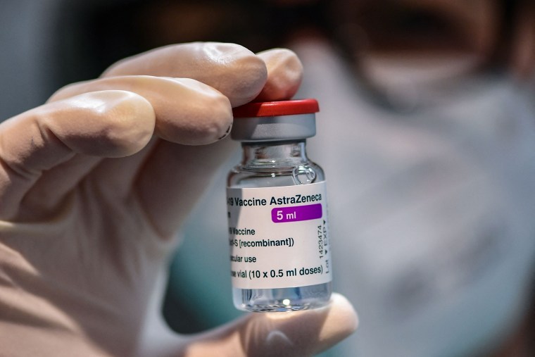 A medical worker holds a vial of the British-Swedish AstraZeneca/Oxford vaccine during a vaccination campaign in Milan.