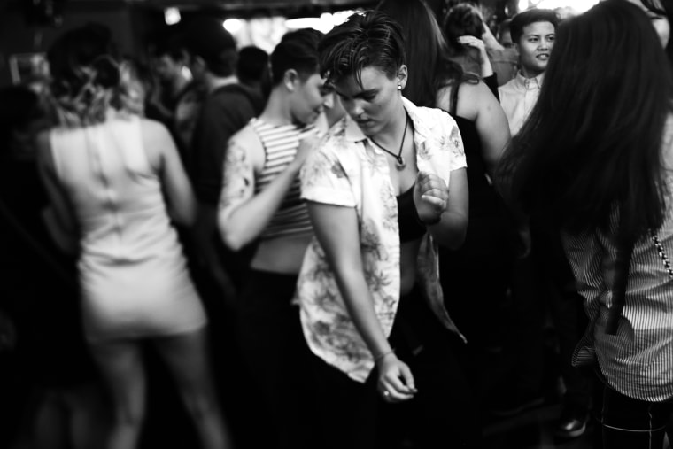 Women dance together at WildRose in Seattle on Aug. 26, 2017.