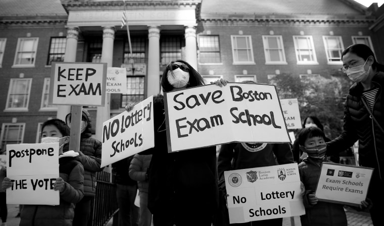 IMage: Protesters call for Boston schools to keep admission exam for elite schools outside of the Boston Latin School on Oct. 18, 2020.