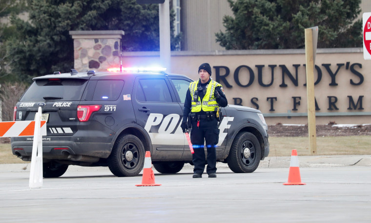 Police respond to an incident at the Roundy's distribution warehouse in Oconomowoc, Wis., on March 17, 2021.