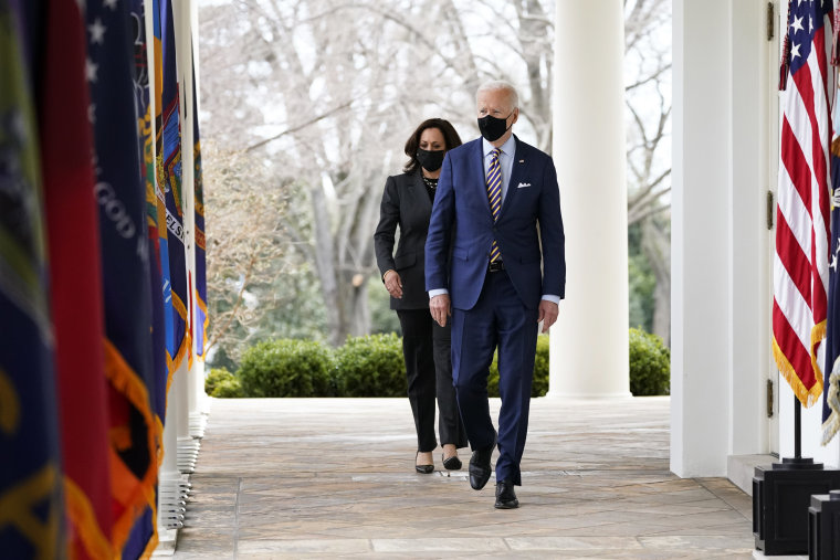 President Joe Biden and Vice President Kamala Harris walk along the Colonnade as they arrive to speak about the American Rescue Plan at the White House on March 12, 2021.
