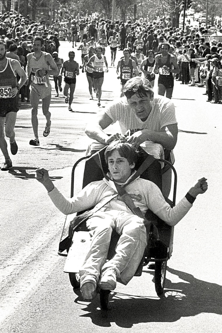 Dick Hoyt, rear, pushes his son Rick as they compete in the Boston Marathon.