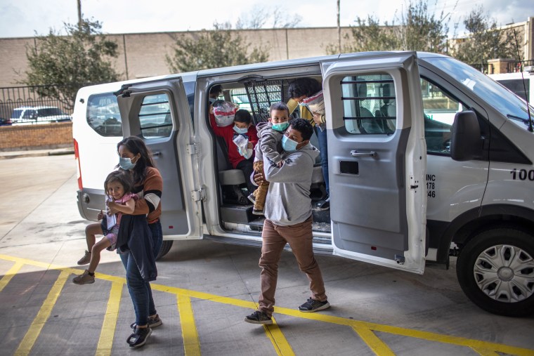 Asylum seekers are released by the U.S. Border Patrol at a bus station on Feb. 26, 2021 in Brownsville, Texas.