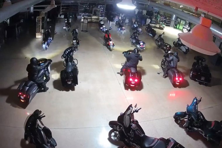 Surveillance video shows four suspects stealing Harley Davidson motorcycles in Kokomo, Ind.