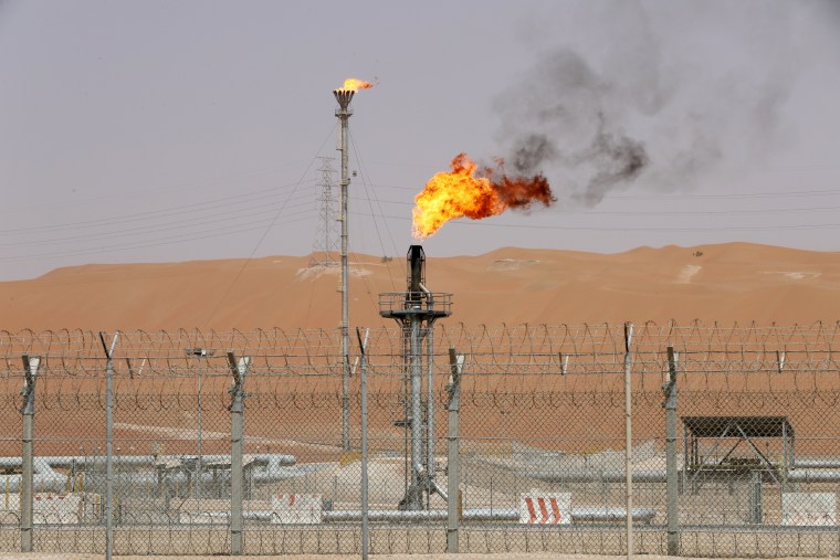 Image: FILE PHOTO: Flames are seen at the production facility of Saudi Aramco's Shaybah oilfield in the Empty Quarter, Saudi Arabia