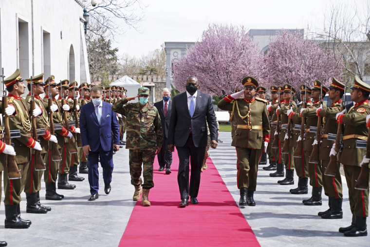 Defense Secretary Lloyd Austin reviews an honor guard at the presidential palace in Kabul, Afghanistan, on March 21, 2021.