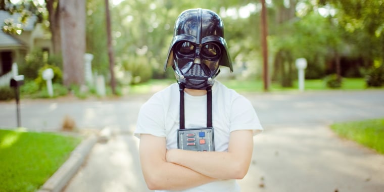 Kid wearing a Darth Vader Mask outside
