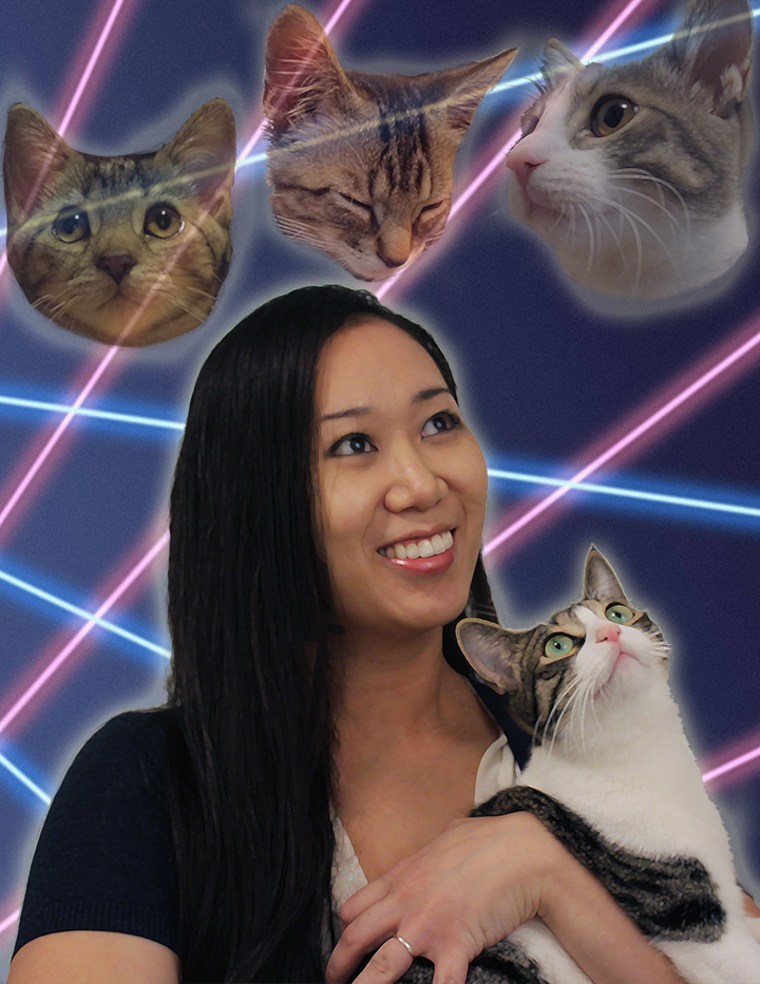 Christina Ha smiles in a laser cats homage