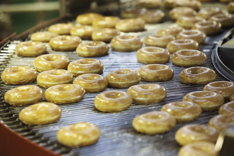Doughnuts on a production line inside a Krispy Kreme store in Times Square on Sept. 10, 2020, in New York.