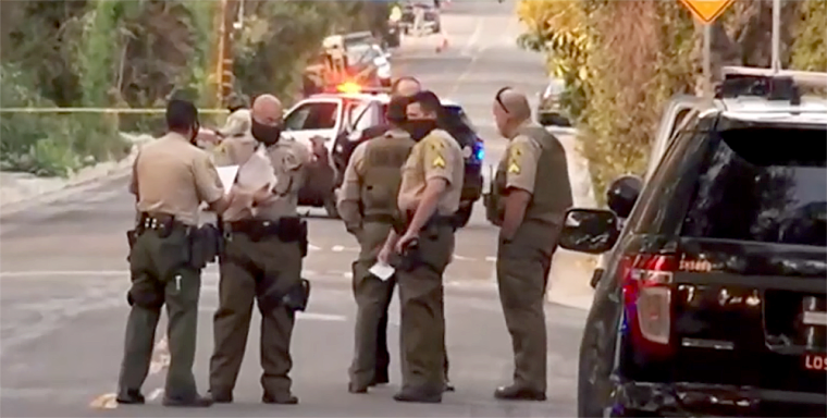 Image: Los Angeles County Sheriff's Department officers at the scene of a stabbing in Altadena, March 22, 2021.