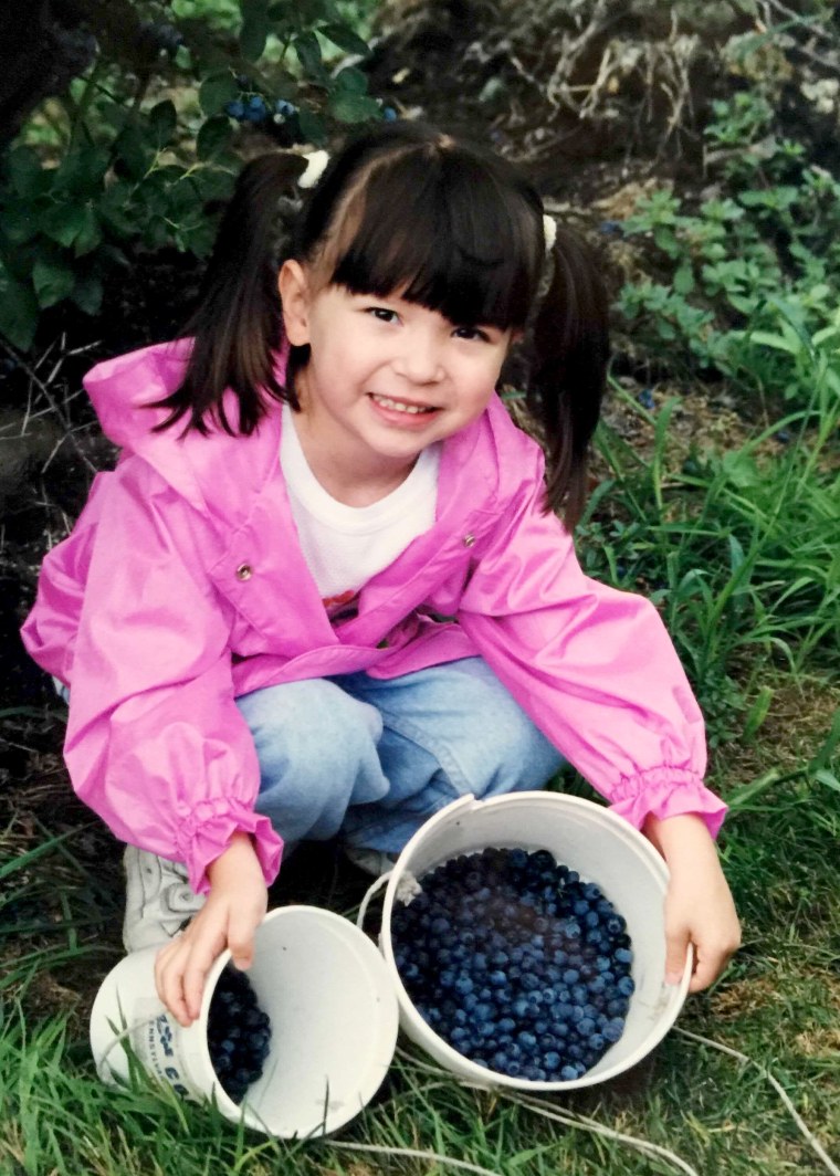 Image: The author picking berries when she was a child.