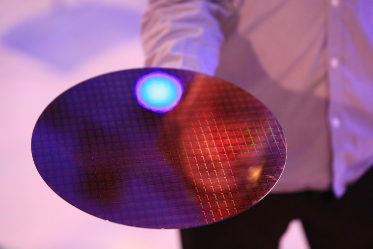 An uncut semiconductor plate sits arranged for a photograph during an Intel Corp. event in Berlin.