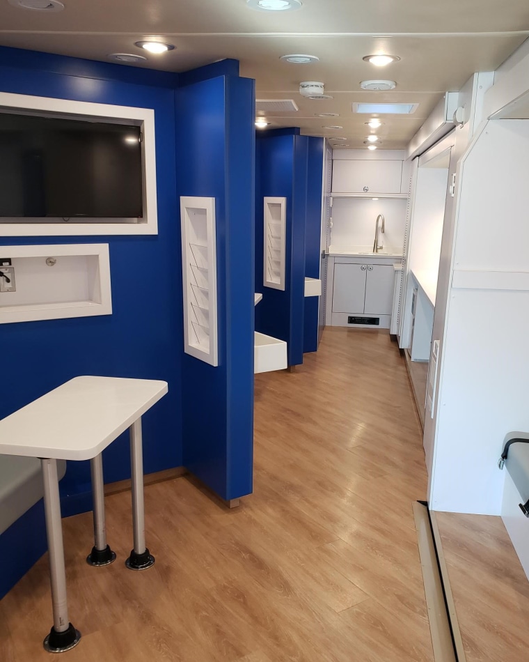 Image: The interior of the New Jersey Health Department's customized vans, showing partitions where Covid-19 vaccine shots can be administered.