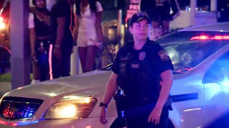 An officer is pictured at the scene of the deadly shooting which happened overnight.