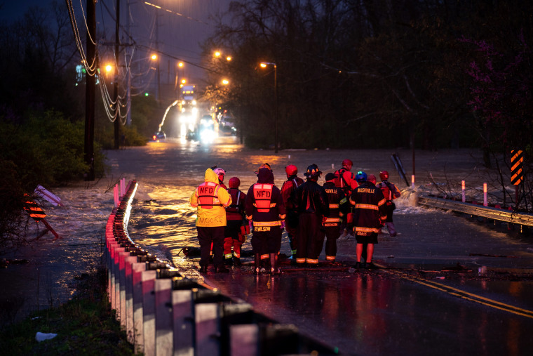 IMAGE: Emergency personnel stage for a call of people stranded in Nashville