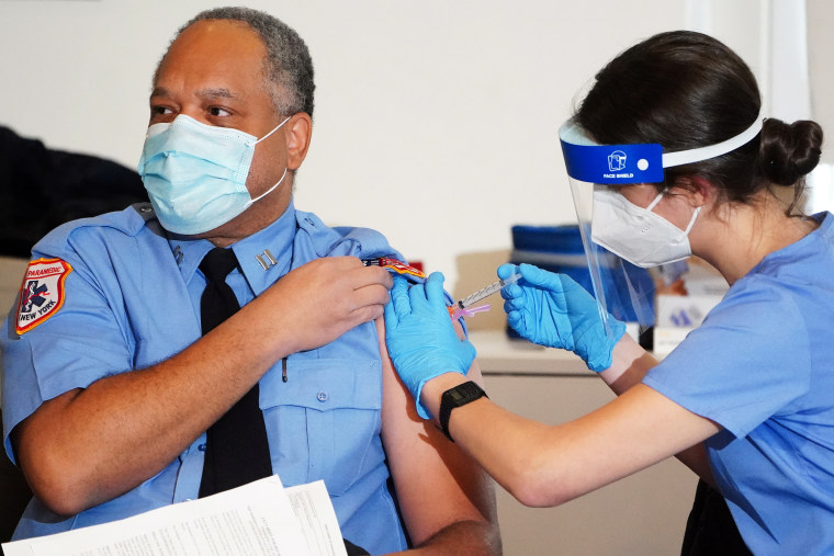 A worker for the New York City Fire Department Bureau of Emergency Medical Services receives Moderna's Covid-19 vaccination on Dec. 23, 2020.