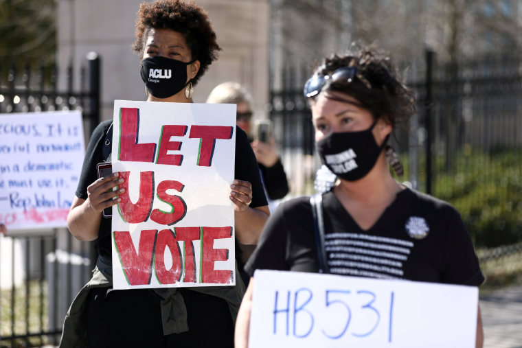 Protesters gather outside of the Georgia State Capitol to protest HB 531 in Atlanta, March 4, 2021.
