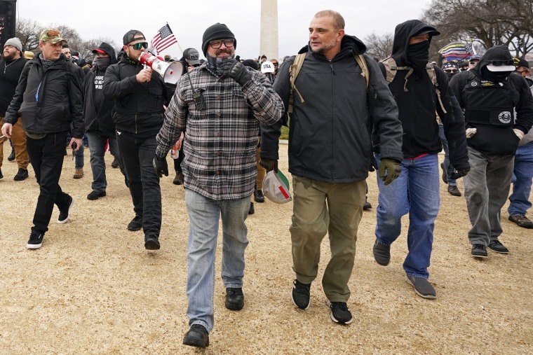 Proud Boys leader Joseph Biggs, front left, walks toward the U.S. Capitol in Washington on January 6,2021.