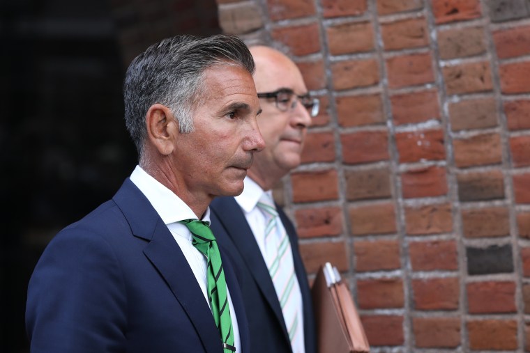 Mossimo Giannulli, left, husband of actress Lori Loughlin, follows her out of the John Joseph Moakley United States Courthouse in Boston on April 3, 2019.