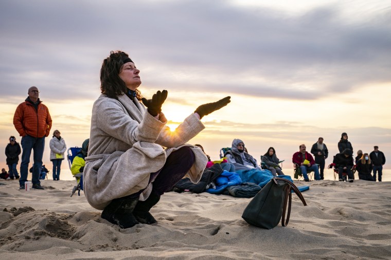 Parishioners gather on a beach for an Easter Sunday service at sunrise hosted by Hope Community Church of Manasquan, on April 4, 2021, in Masaquan, N.J.