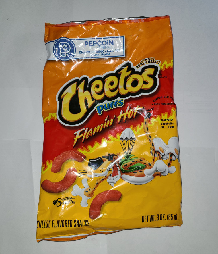 a bag of flaming hot cheetos puffs against a white background