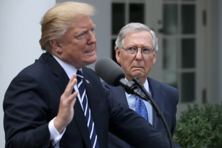 Image: U.S. President Donald Trump and Senate Majority Leader Mitch McConnell (R-KY) talk to reporters in the Rose Garden following a lunch meeting at the White House Oct. 16, 2017 in Washington, DC.