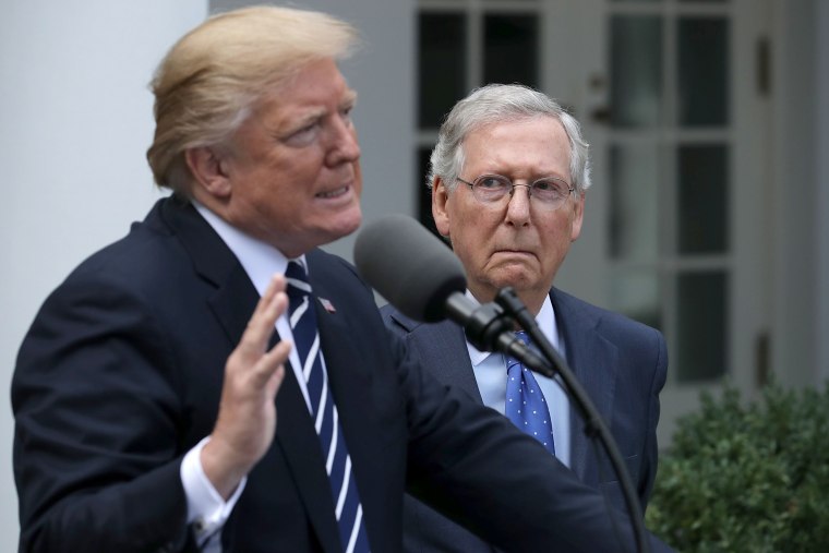 President Donald Trump and Senate Majority Leader Mitch McConnell speak to reporters in the Rose Garden of the White House on Oct. 16, 2017.