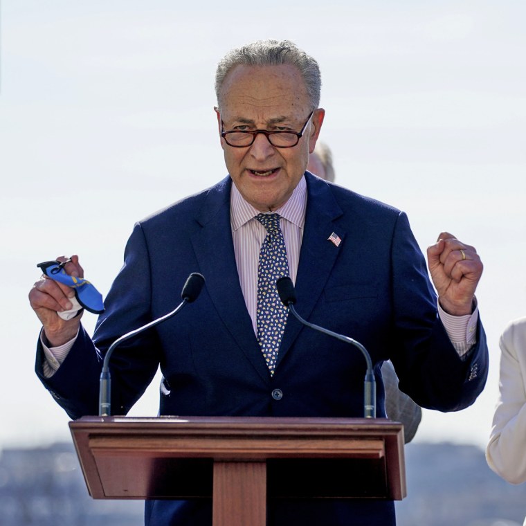 Image: Senate Majority Leader Chuck Schumer speaks before they sign the $1.9 trillion Covid-19 relief bill during a bill enrollment ceremony on the West Front of the Capitol on March 10, 2021.