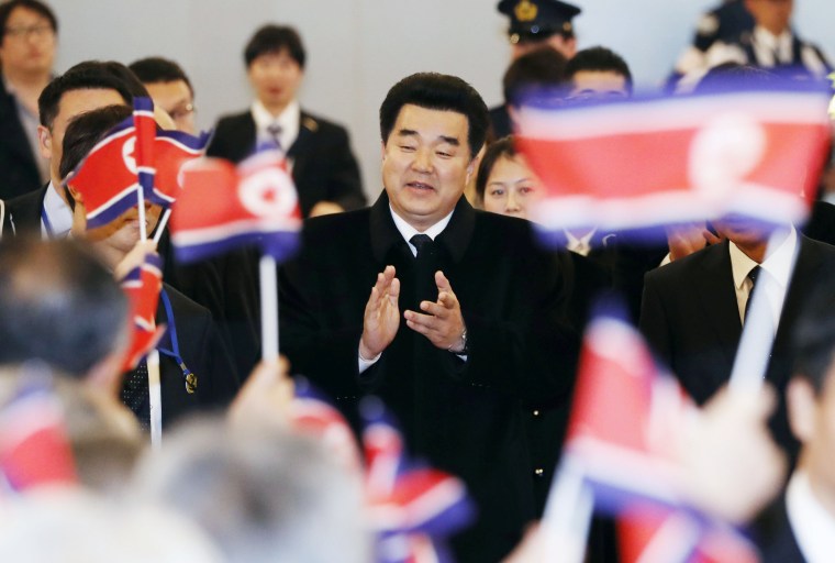 Kim Il Guk, North Korea's sports minister and the president of the Olympic Committee of North Korea is greeted by North Korean residents upon his arrival at Tokyo's Haneda airport on November 27, 2018.