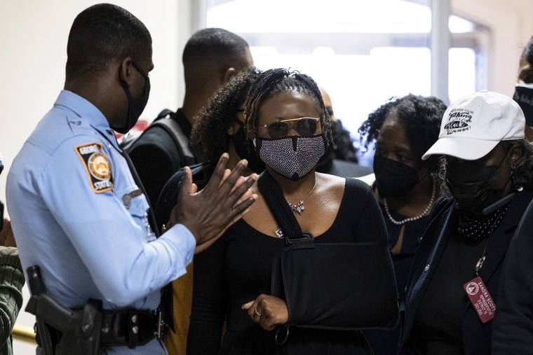 Georgia State Rep. Park Cannon, D-Atlanta, walks past a Georgia State Patrol officer as she returns to the capitol in Atlanta on March 29, 2021.