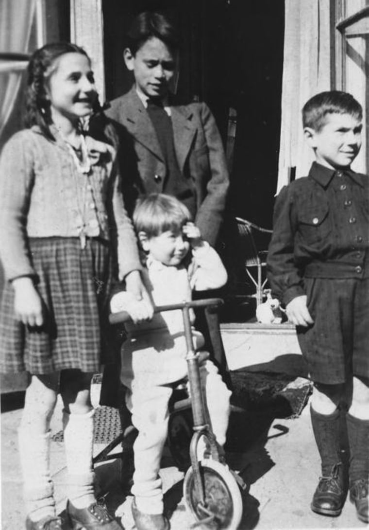 While sharing his testimony, Al Munzer often shows this photograph of Helga Friederizi, Rob Madna, Al, on the tricycle, and Arthur Friederizi with whom he reconnected this past year.