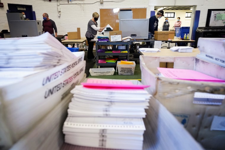 Chester County election workers scan mail-in and absentee ballots for the 2020 election on Nov. 4 in West Chester, Pa.