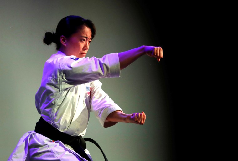 Sakura Kokumai, an Olympic athlete and member of Team Panasonic, performs karate moves at a Panasonic news conference during the 2020 CES in Las Vegas