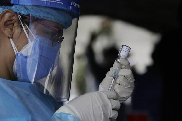 Image: A healthcare worker prepares a dose of the AstraZeneca vaccine in Quito, Ecuador, on April 8, 2021.