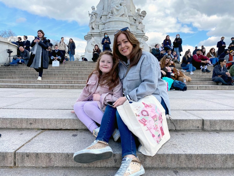 Emma Bedford,42, who came to lay flowers against the palace railings with her five-year-old daughter Evie