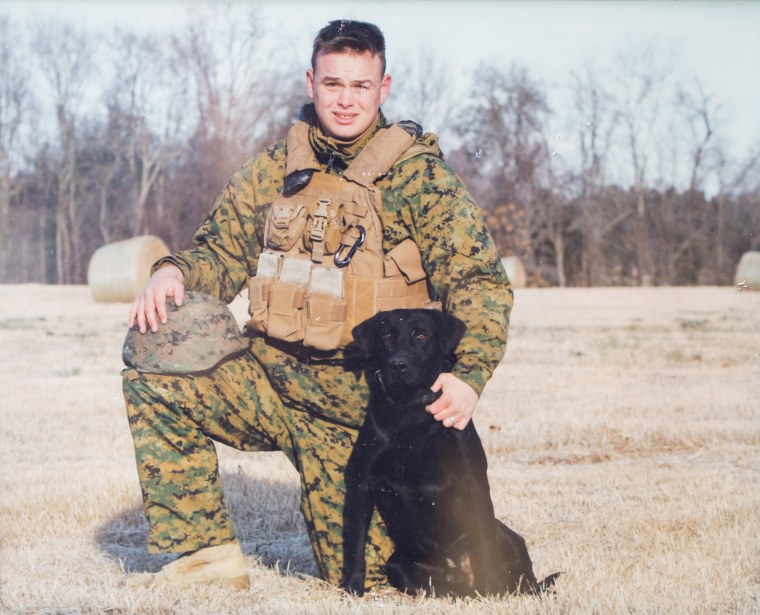 Scott Evans and his black Labrador Joker